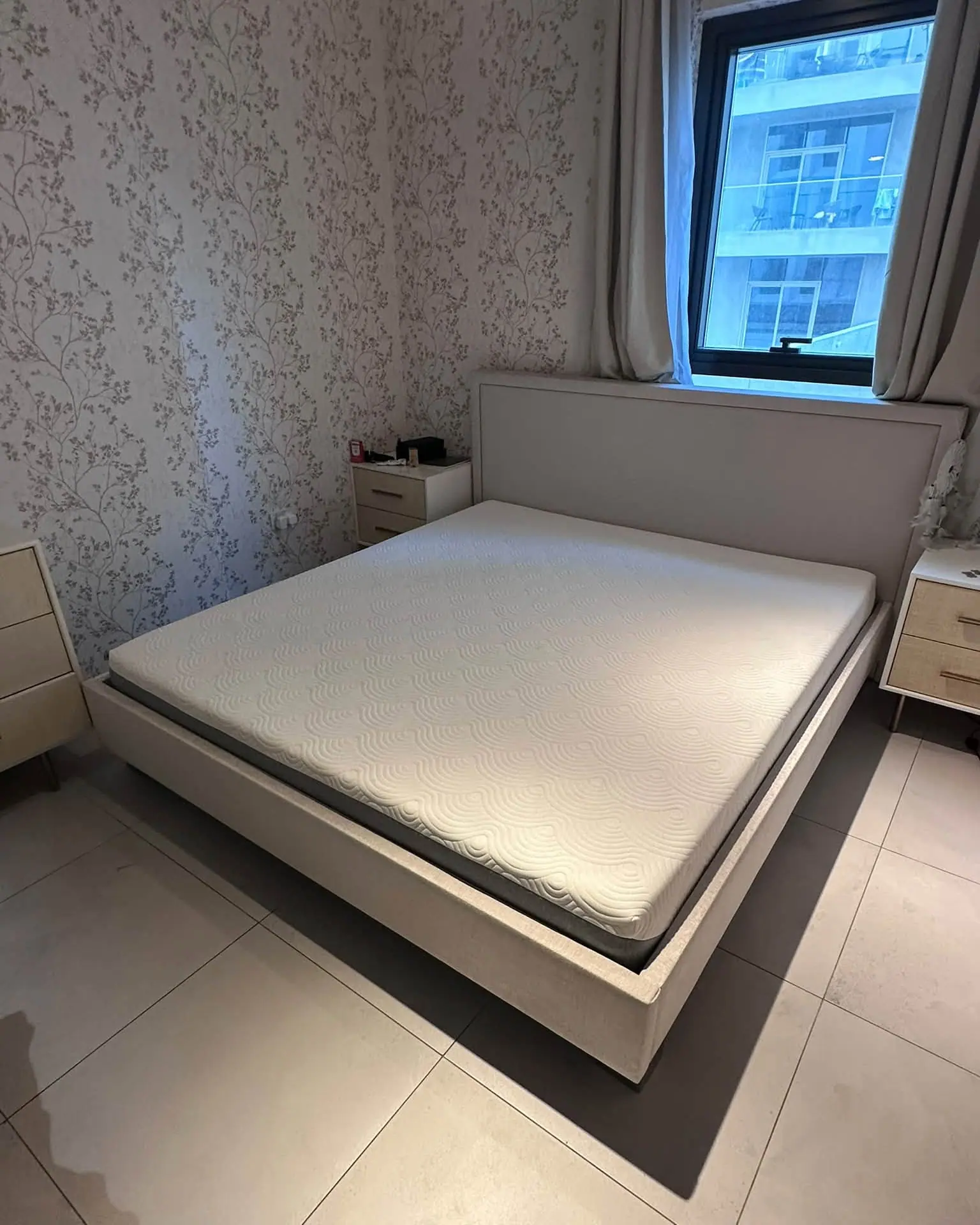 Complete bedroom set with bed frame and matching bedside tables bought from a Dubai apartment